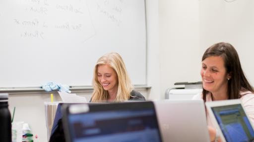 two students researching online